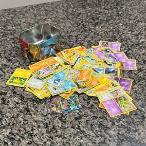Pokemon Yellow and Purple Assorted Trading Cards Tin Lot